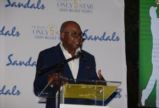 Tourism Minister, Hon. Edmund Bartlett, addresses the welcome ceremony for the 18th annual USA Travel Advisor Golf Tournament at Sandals Ochi Rios Beach Resort in St. Ann,  on Saturday (September 10).

