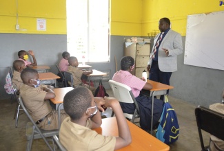 Principal of Adelphi Primary School in St. James, Marlon Campbell, welcomes grade-six students on the first day of the 2022/23 academic year, on Monday (September 5).