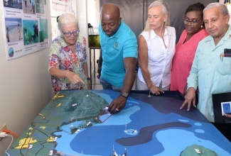 Agriculture and Fisheries Minister, Hon. Pearnel Charles Jr. (second left), is shown a model of the Portland Bight Protected Area (PBPA) during a visit and tour of the Portland Bright Discovery Centre in Clarendon on Friday (September 9). From left are Lead Consultant, Ann Sutton; Head of the European Union Delegation to Jamaica, Belize, The Bahamas, Turks and Caicos Islands and Cayman Islands, Ambassador Marianne Van Steen; Executive Director, Caribbean Coastal Area Management Foundation, Ingrid Parchment; and Mayor of May Pen, Councillor Winston Maragh.

