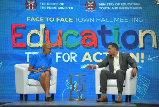 Prime Minister, the Most Hon. Andrew Holness (right), consults with Education and Youth Minister, Hon. Fayval Williams, during the question and answer session at Friday’s (September 9) town hall at Jamaica College, in St. Andrew. The meeting was organised by the Office of the Prime Minister (OPM).

