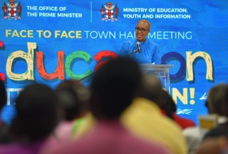 Minister of Education and Youth, Hon. Fayval Williams, addresses a recent townhall meeting on education, which was held at Jamaica College in St. Andrew. 