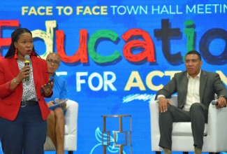 Prime Minister, the Most Hon. Andrew Holness (right), and Minister of Education and Youth, Hon. Fayval Williams (left, seated), listen as Acting Chief Education Officer in the Ministry, Dr. Kasan Troupe, answers questions during the Office of the Prime Minister’s Face-to-Face Town Hall meeting at Jamaica College in St. Andrew, on Friday (September 9).

