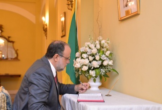 Leader of the Opposition, Mark Golding, signs the Condolence Book which was opened at King’s House for the United Kingdom’s late Monarch, Her Majesty, The Queen. Mr. Golding signed on Sunday (September 11).

