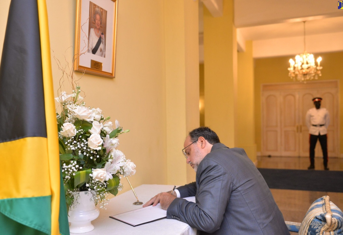 PHOTOS: Opposition Leader, Mark Golding, signs Condolence Book at King’s House