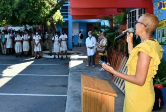 Minister of Education, Youth and Information, Hon. Fayval Williams, addresses a ceremony for the handover of a gazebo, scholarships, tablets and a printer to the Camperdown High School in Kingston on Monday (October 24), by the Florida Chapter of the school’s past student association.