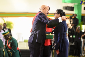 Governor-General, His Excellency, the Most Hon. Sir Patrick Allen, presents Chief Medical Officer (CMO), Dr. Jacquiline Bisasor-McKenzie with the Order of Distinction in the rank of Commander (CD) for outstanding public service in the field of health, during the National Honours and Awards presentation ceremony held at King’s House on Monday (October 17). 