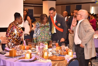 Prime Minister, the Most Hon. Andrew Holness (third left), congratulates Permanent Secretary in the Office of the Prime Minister and the Ministry of Economic Growth and Job Creation, Audrey Sewell (second left), on her Order of Jamaica (OJ) award, which was presented during the Ceremony of Investiture and Presentation of National Honours and Awards at King’s House on Monday (October 17). Mrs. Sewell was recognised for distinguished contribution to public service. The reception was held at The Jamaica Pegasus hotel in Kingston, Monday afternoon. Sharing the moment are Minister of Culture, Gender Entertainment and Sport, Hon. Olivia Grange, who also received the OJ and former Cabinet Minister, Dr. Omar Davies (right).