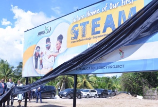 Prime Minister, the Most Hon. Andrew Holness (second right), unveils a billboard marking the future home of Jamaica’s first Science, Technology, Engineering, the Arts and Mathematics (STEAM) Academy at Dunbeholden in Bernard Lodge, St. Catherine, on Tuesday (October 25). Joining him are Minister of Education and Youth, Hon. Fayval Williams (right) and (from left) Acting Permanent Secretary in the Ministry, Maureen Dwyer; Member of Parliament for St. Catherine Southern, Fitz Jackson; and Chairman, National Education Trust, Ryan Reid.