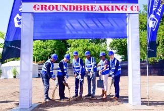 Prime Minister, the Most Hon. Andrew Holness (third left), breaks ground for The Howard Apartments that will be constructed at 10-16 Howard Avenue, St. Andrew South West, today (November 9). Under the project, 248 studio apartments will be constructed. Also participating are (from left) Managing Director, National Housing Trust (NHT), Martin Miller; Ambassador of the People’s Republic of China to Jamaica, His Excellency Daojiang Chen; Chairman, NHT, Lennox Channer; Member of Parliament for St. Andrew South Western, Dr. Angela Brown-Burke and Managing Director, Centauri Real Estate Company Limited, Julian Zhu. 