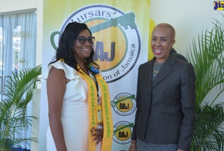 Minister of Education and Youth, Hon Fayval Williams (right), interacts with Bursars Association of Jamaica (BAJ) President, Charmian Christie, during the 22nd annual Caribbean Bursars’ Conference at the Grand Palladium Hotel in Hanover on November 18.