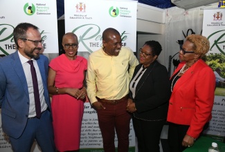 Minister of Education and Youth, Hon. Fayval Williams (second left), engages in a light exchange with (from left) UNICEF Country Representative, Vicente Teran; Chief Executive Officer (CEO) and Co-Founder, Proven Investments Limited, Christopher Williams; CEO, National Parenting Support Commission (NPSC), Kaysia Kerr, and Acting Permanent Secretary in the Ministry, Maureen Dwyer, at the official launch of activities to observe National Parent Month, at the Terra Nova All-Suite Hotel in St. Andrew, on November 1. National Parent Month is being observed in November under the theme ‘Reignite the Village’.



