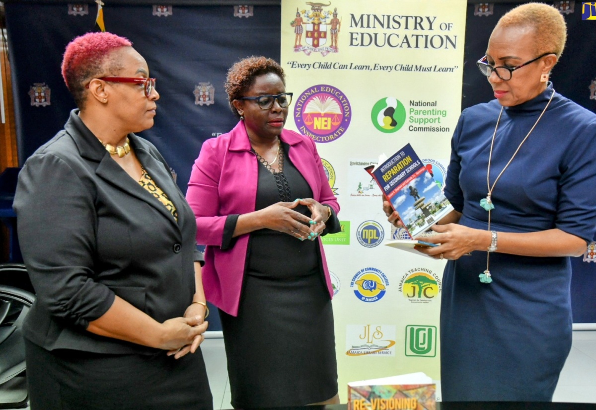 PHOTOS: Minister Williams Receives Books from UWI Press