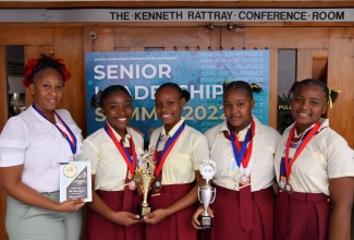 The Wycliffe Martin High School team from in St. Mary, show off their prizes for placing second in the 2021-2022 Junior Achievement Jamaica (JAJ) company of the year competition, at the awards ceremony held at the Jamaica Conference Centre in Kingston on Tuesday (November 15). They are (from left) teacher Tameka Thompson (left) and students Suzan Beckford, Seanna Sterling, Rusheen Rose and Mikalia Manasseh. 