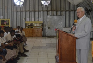 Minister of Justice, Hon. Delroy Chuck, addresses students at the St. James High School in Montego Bay, during the final stop of the Ministry’s Alternative Justice Services school tour, recently. 

