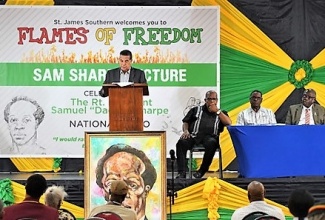 Minister of State in the Office of the Prime Minister (OPM-West), Hon. Homer Davis, delivering remarks during the inaugural Sam Sharpe Lecture at the Montego Bay Cultural Centre on December 22.