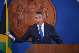 Prime Minister, the Most Hon. Andrew Holness, addresses a press conference at the Office of the Prime Minister recently to announce states of public emergency in several parishes islandwide.