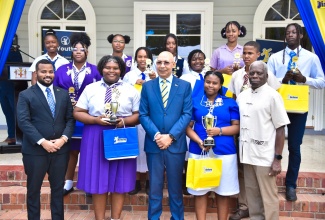 Governor-General, His Excellency the Most Hon. Sir Patrick Allen (centre, front); National Coordinator, Governor-General Programme for Excellence (GGPE), Abrahim Simmonds (left, front) and Secretary General of the United Nations Educational, Scientific and Cultural Organization’s (UNESCO) National Commission, Everton Hannam (right, front), share with winners in the inaugural Media and Information Literacy (MIL) Essay Competition, at the awards ceremony held on January 25 at King’s House.