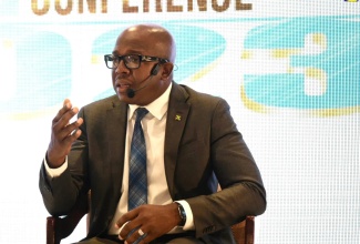 Minister of Agriculture and Fisheries, Hon. Pearnel Charles Jr., leads a discussion at the 18th Jamaica Stock Exchange Investment and Capital Markets Conference on January 25, at The Jamaica Pegasus hotel in New Kingston. 