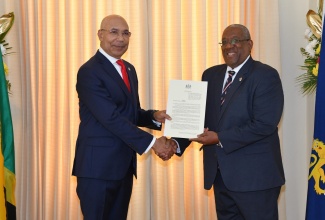 Governor-General, His Excellency, the Most Hon. Sir Patrick Allen (left), presents the signed Proclamation marking January 7 as ‘UWI Day’, to Pro-Vice Chancellor and Principal of the University of the West Indies (UWI), Mona, Professor Dale Webber, during a courtesy call at King’s House in Kingston on Thursday (January 5). The Proclamation invites all citizens to reflect on the achievements of the institution and participate in celebratory activities in observance of the UWI’s 75th anniversary.