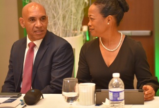 Police Commissioner, Major General Antony Anderson (left), converses with Chief of Defence Staff (CDS), Rear Admiral Antonette Wemyss Gorman, during the national security seminar hosted by the Office of the National Security Advisor, at the AC Marriott Hotel Kingston on Thursday (January 12).