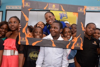 Caption: Acting Special Projects Manager, Jamaica Information Service (JIS), Charnele Henry (centre) shares in a selfie-frame photo with Grade 4 students of the Belmont Park Primary School in Portmore, St. Catherine on Tuesday (February 21). Occasion was the school’s Career Day under the theme: ‘Conquer your Future through Career Development’. The Grade 4 students focused on ‘Media, Communication and Entertainment’ and were engaged by the JIS in discussions about careers in media.