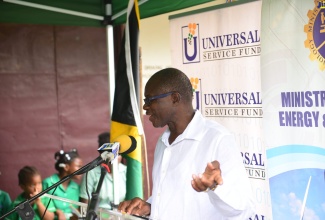 Member of Parliament for St. Catherine South Western, Hon. Everald Warmington, addresses the unveiling of a free secured Wi-Fi hotspot in Old Harbour Bay, recently.