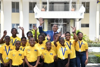 Prime Minister the Most. Hon. Andrew Holness (centre, background), shares a moment with the finalists in the 2023 Gleaner Children’s Own Spelling Bee competition, during a courtesy call on Thursday (February 9) at Jamaica House.