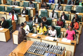 Minister of Culture, Gender, Entertainment and Sport, Hon. Olivia Grange, engages with members of the Young Women in Leadership Parliament, just before the start of the historic all-female sitting at Gordon House on Tuesday (February 21).