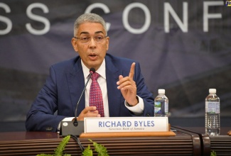 Bank of Jamaica (BOJ) Governor, Richard Byles, addressing journalists during the institution’s recent quarterly media briefing at the BOJ Auditorium in downtown Kingston. 