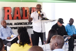 Minister of Agriculture and Fisheries, Hon. Pearnel Charles Jr. (second left), addresses the recent handover of six rubber-wheel farm tractors to the Rural Agricultural Development Authority (RADA) at the Agro-Investment Corporation in Kingston. Others pictured are (from left) Chief Technical Director in the Ministry, Courtney Cole; Vice Chairman, RADA Board of Directors, Richard King; and Acting Chief Executive Officer, RADA, Winston Simpson.


