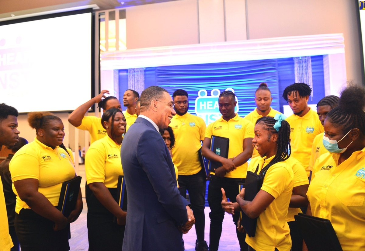 Prime Minister, the Most Hon. Andrew Holness (centre), speaks with participants in the Jamaica National Service Corps (JNSC) Residential Camps, at the official launch of the programme on Friday (March 24), at the AC Marriott Hotel in St. Andrew. 

