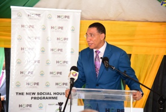 Prime Minister, the Most Hon. Andrew Holness,  addresses the handover of a two-bedroom house under the Government’s Social Housing Programme, in Roaring River, Westmoreland, on April 26.