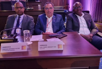 The Jamaican delegation at the recent 18th Caribbean Council of Ministers of Postal Affairs Meeting in Miami, Florida. From left are Postmaster General of the Post and Telecommunications Department (Jamaica Post), Lincoln Allen; Minister of Science, Energy and Technology, Hon. Daryl Vaz and Deputy Postmaster General of the Jamaica Post, Carey Brown. 