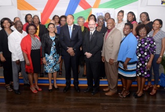 Minister of Health and Wellness, Dr. the Hon. Christopher Tufton (fifth left, front row); Chief Medical Officer, Dr Jacquiline Bisasor-McKenzie (fourth left, front row) and Pan-American Health Organization (PAHO)/World Health Organization (WHO) Representative in Jamaica, Ian Stein (fourth right, front row), are joined by officers from the Health Ministry and key stakeholders during the launch of the Problem Management Plus (PM+) initiative on March 14, at the Spanish Court Hotel in New Kingston.