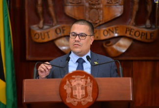 Minister without Portfolio in the Ministry of Economic Growth and Job Creation, Senator the Hon. Matthew Samuda, addresses a post-Cabinet press briefing at Jamaica House on Wednesday (April 26).
