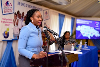 Children’s Advocate, Diahann Gordon Harrison, addresses a press conference at the Terra Nova All-Suite Hotel in St. Andrew on May 17.  