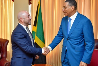 Prime Minister, the Most Hon. Andrew Holness (right), greets Chief Executive Officer of Digicel Jamaica, Stephen Murad, during a courtesy call on Wednesday (May 10) at the Office of the Prime Minister (OPM). 