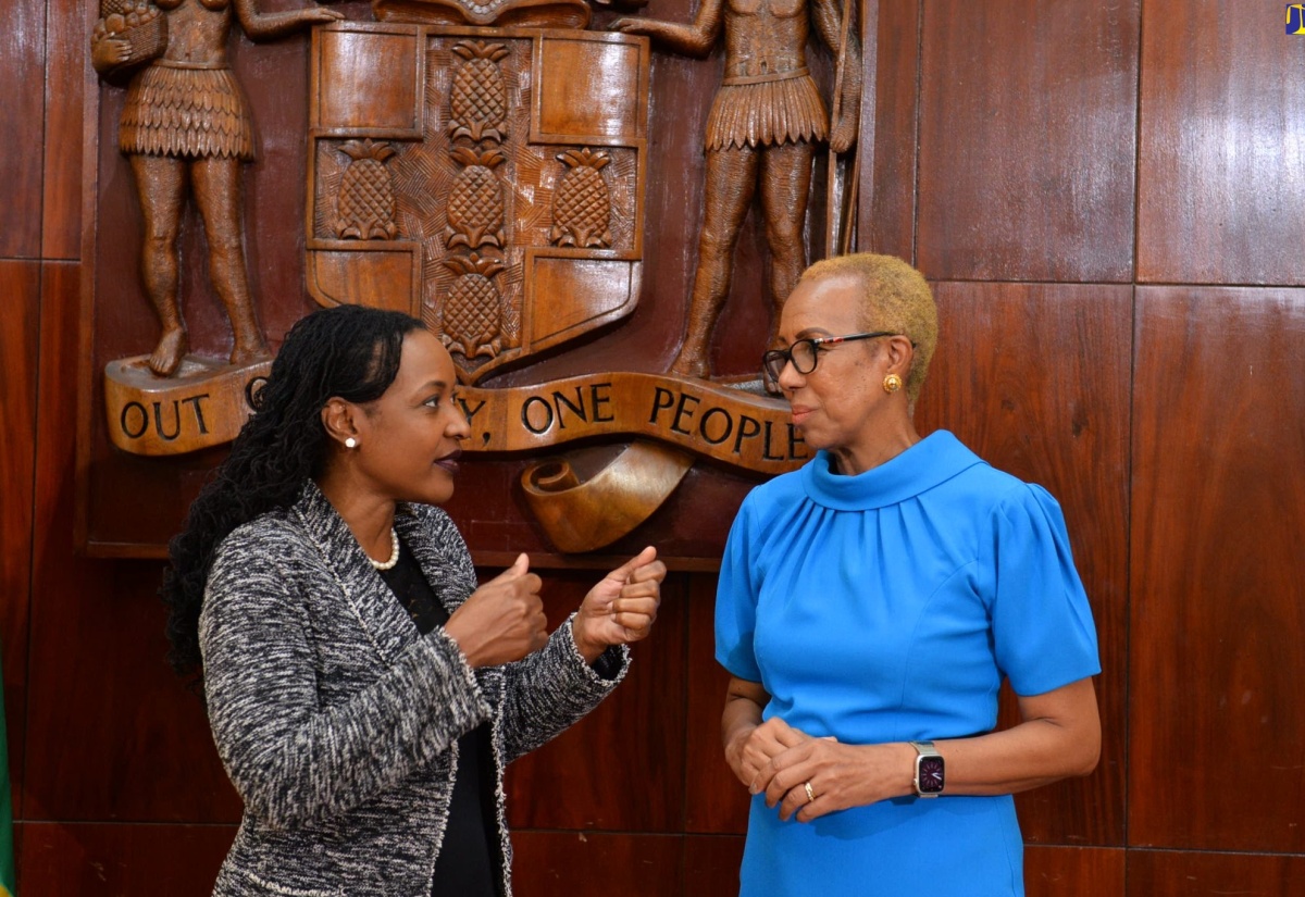 Minister of Education and Youth, Hon. Fayval Williams (right), converses with Minister of State in the Ministry, Hon. Marsha Smith, at today’s (May 31) post-Cabinet press briefing, at Jamaica House in St. Andrew. 