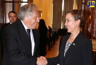 Minister of Foreign Affairs and Foreign Trade, Senator the Hon. Kamina Johnson Smith, is warmly greeted by Secretary General, Organization of American States (OAS), Luis Almagro, during the 53rd OAS General Assembly in Washington, D.C. on June 22.