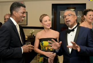 Minister of Foreign Affairs and Foreign Trade, Senator the Hon. Kamina Johnson Smith (centre) shares in light conversation with President, Jamaica Chamber of Commerce (JCC), Michael McMorris (right) and Immediate Past President, JCC, Ian Neita, at the organisation’s 38th annual Dinner and Awards Banquet held at the Jamaica Pegasus Hotel in New Kingston on May 31.