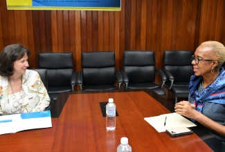 Minister of Education and Youth, Hon. Fayval Williams (right), speaks with United Nations Children’s Fund (UNICEF) Representative to Jamaica, Olga Isaza, during a courtesy call at the Ministry in Kingston on Wednesday (June 7).

