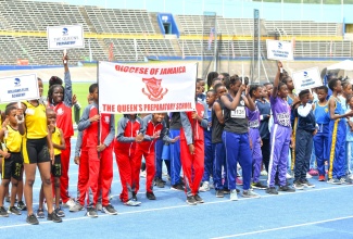 Students of various preparatory schools display their institutions’ banners during the opening ceremony for the Jamaica Independent Schools’ Association (JISA) National Preparatory Schools Track and Field Championships, held recently at the National Stadium in Kingston. 