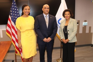 Jamaica’s Ambassador to the United States (US), Audrey Marks, shares a photo opportunity with (from left), Deputy Administrator for the United States Agency for International Development (USAID), Paloma Adams-Allen, and new USAID Country representative for Jamaica, Dr. Jay Singh, at the swearing-in ceremony for Dr. Singh, held at the USAID headquarters in Washington DC.