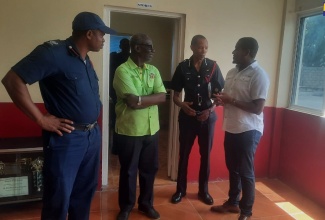 Minister of Local Government and Community Development, Hon. Desmond McKenzie (second left); Minister of Agriculture, Fisheries and Mining and Member of Parliament for St. Elizabeth South Western, Hon. Floyd Green (right) and Superintendent at the Jamaica Fire Brigade (JFB) Black River Station, Kemar Brooks (left), are briefed by JFB Commissioner, Stewart Beckford, during a tour of the newly renovated station in St. Elizabeth recently.