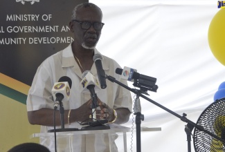 Minister of Local Government and Community Development, Hon. Desmond McKenzie, addresses a recent ceremony to officially open the Ocho Rios Night Shelter in St. Ann.