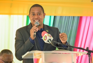 Minister of Agriculture, Fisheries and Mining, Hon. Floyd Green, addresses the reopening ceremony for the Broadleaf Health Centre,in Manchester Central, on August 22.