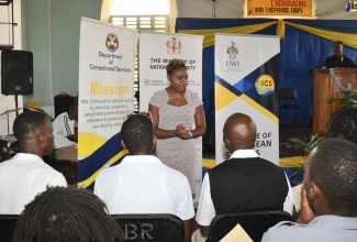 Minister of State in the Ministry of National Security, Hon. Juliet Cuthbert-Flynn, addresses some of the inmates and Correctional Officers who successfully completed training within the entertainment sector, under the University of the West Indies (UWI)-Mona Prison Project (UMPP), at a graduation ceremony, held today (August 22), at the Tower Street Adult Correctional Centre in downtown Kingston.