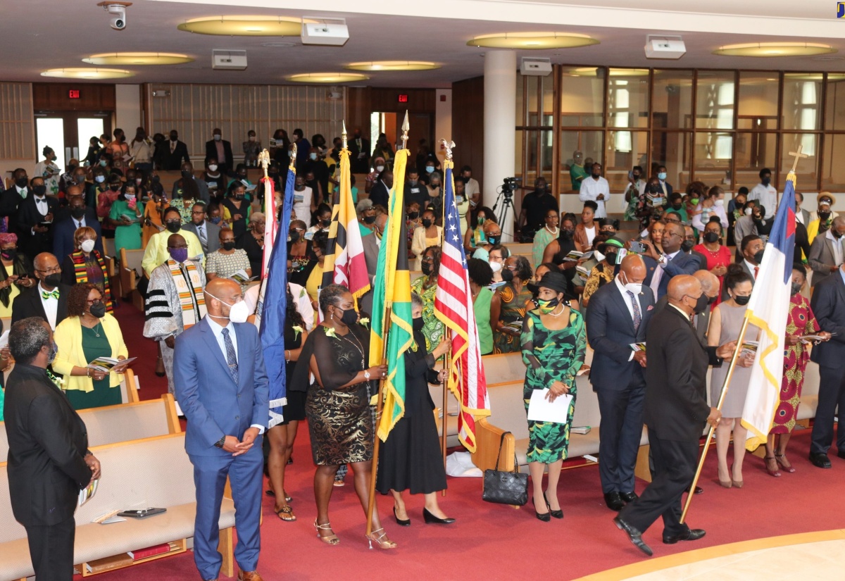 Ambassador to the United States (US), Her Excellency Audrey Marks (fifth left), looks on as flag bearers enter the Sligo Seventh-Day Adventist Church in Takoma Park, Maryland, during the tthanksgiving service to mark Jamaica’s 60th anniversary of Independence last year.