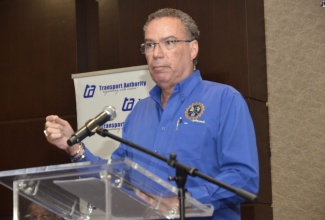 Minister of Science, Energy, Telecommunications and Transport, Hon. Daryl Vaz, addresses transport operators during a retreat held at the Moon Palace Hotel in Ocho Rios, St. Ann, on July 13.