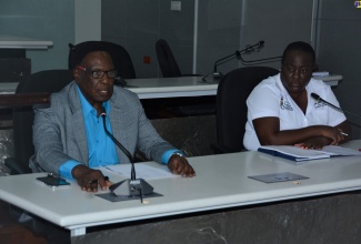 Mayor of Montego Bay and Chairman of the St. James Municipal Corporation, Councillor Leeroy Williams (left), outlines plans for Emancipation and Independence celebrations in August, during the launch of the celebratory activities at the Corporation in Montego Bay on Monday, July 17. Looking on is the Jamaica Cultural Development Commission (JCDC) Parish Manager for St. James, Collel Blake.